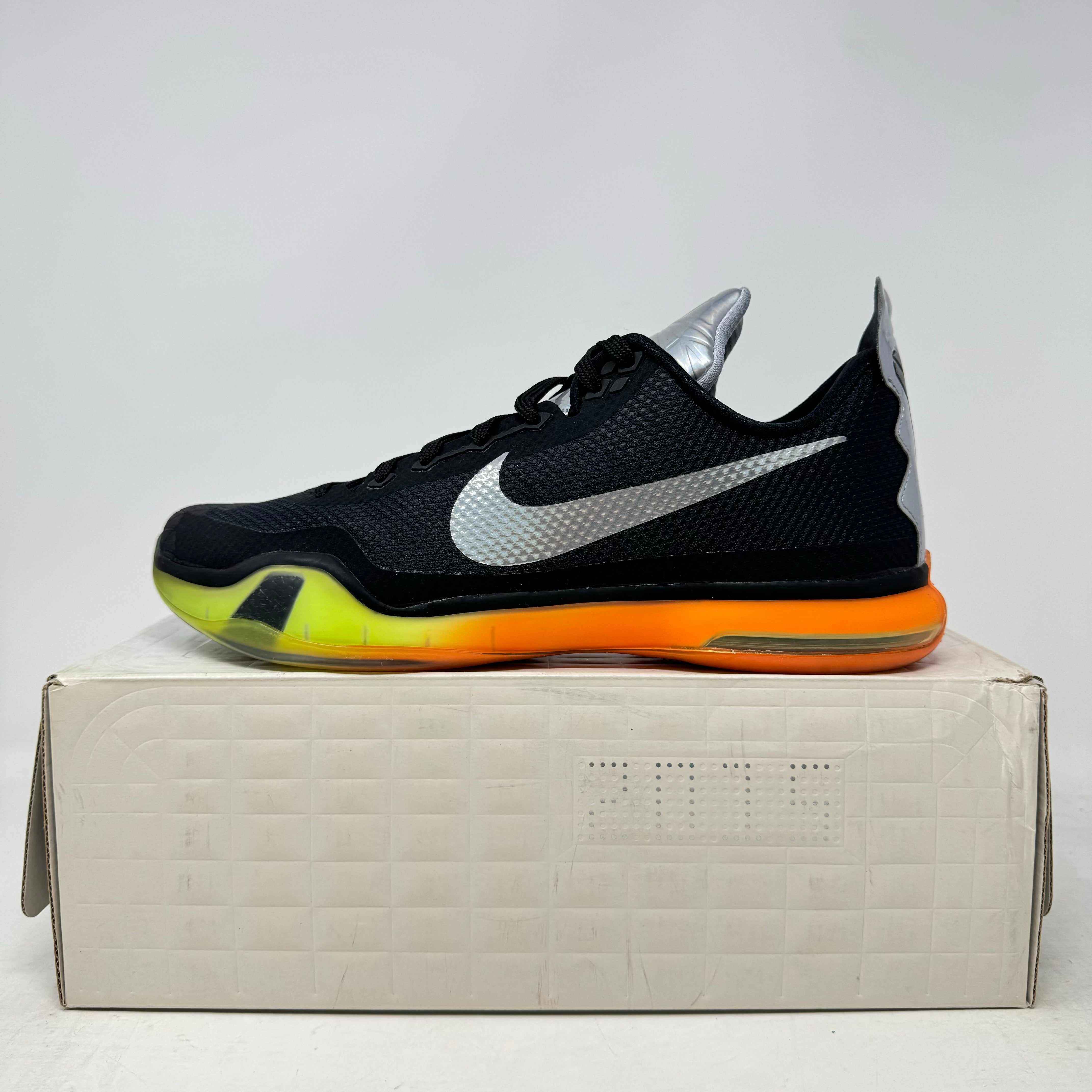Nike Kobe 10 All-Star black sneaker with silver swoosh and orange sole on white box