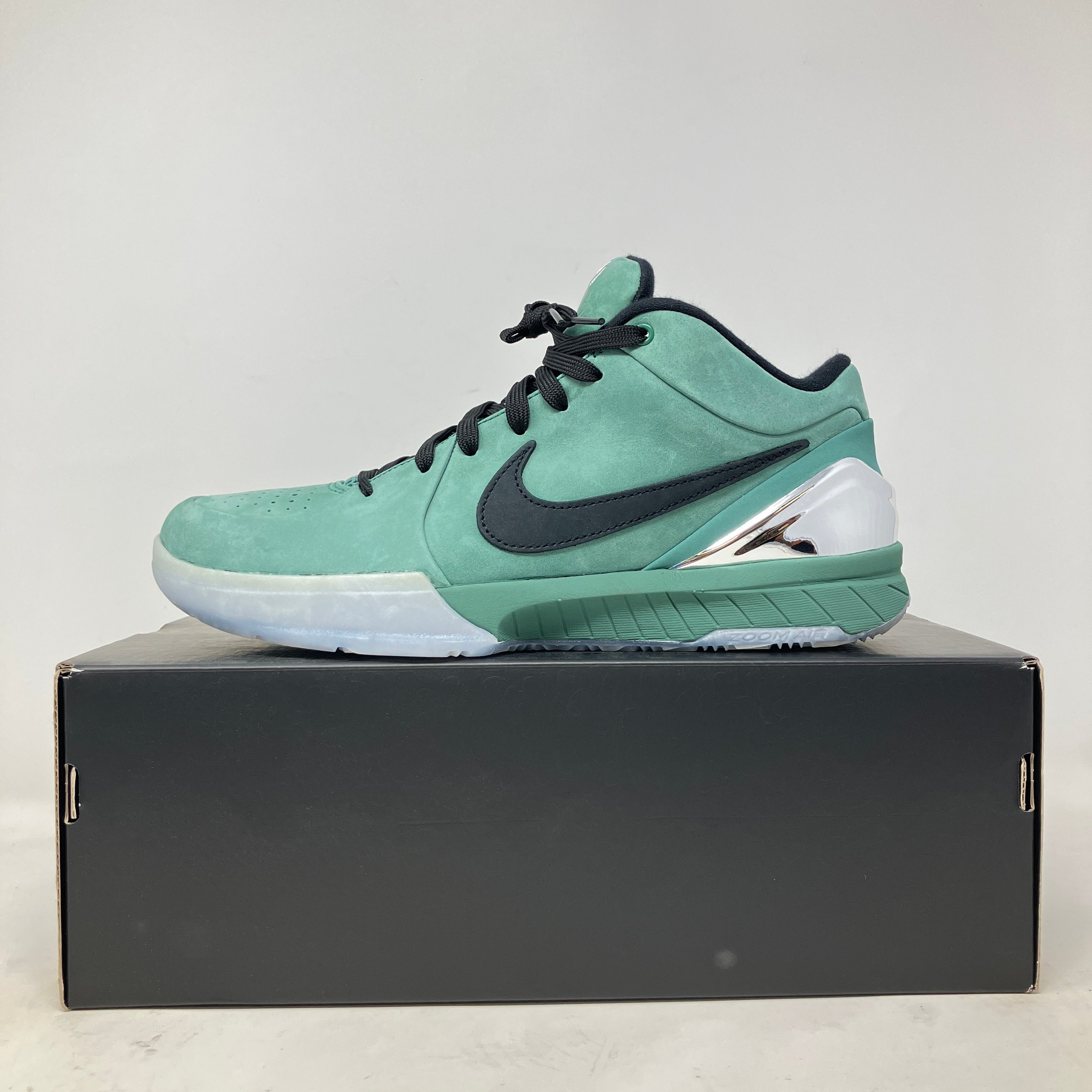Nike Kobe 4 Protro Girl Dad sneaker in green with black swoosh on black box, pre-owned condition with accessories included