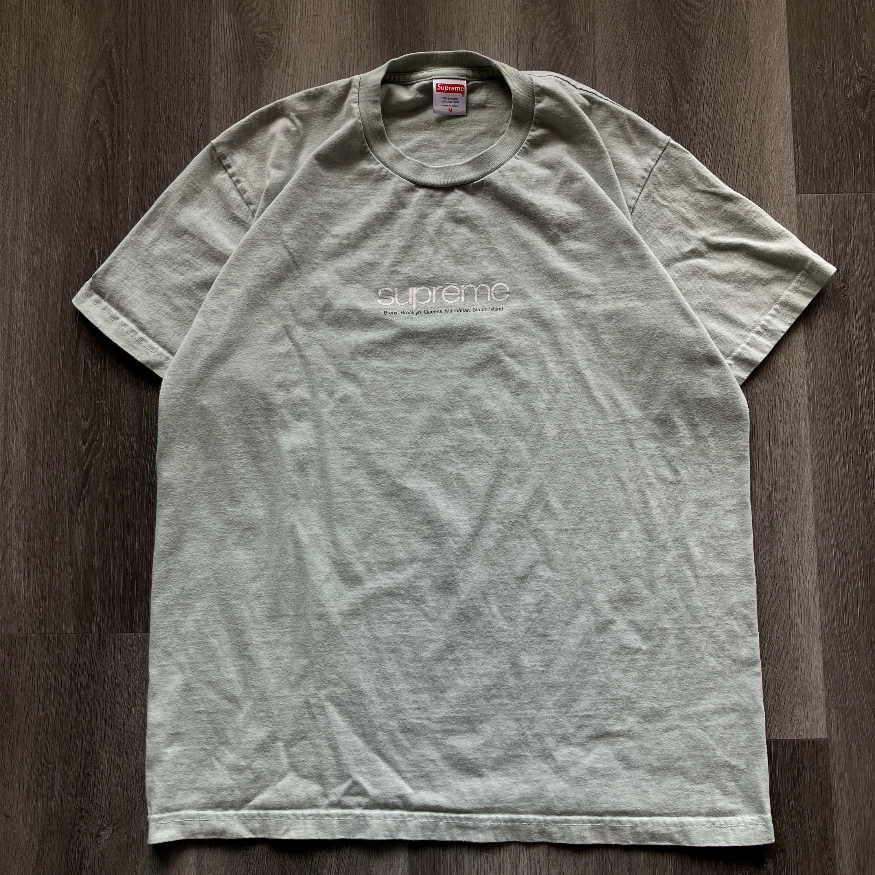 Light teal Supreme Shop Tee, pre-owned.