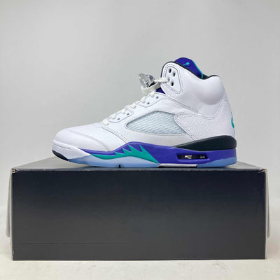 Jordan 5 Retro Grape high-top sneaker in white leather with mesh panels, purple and teal accents, and visible lace lock.