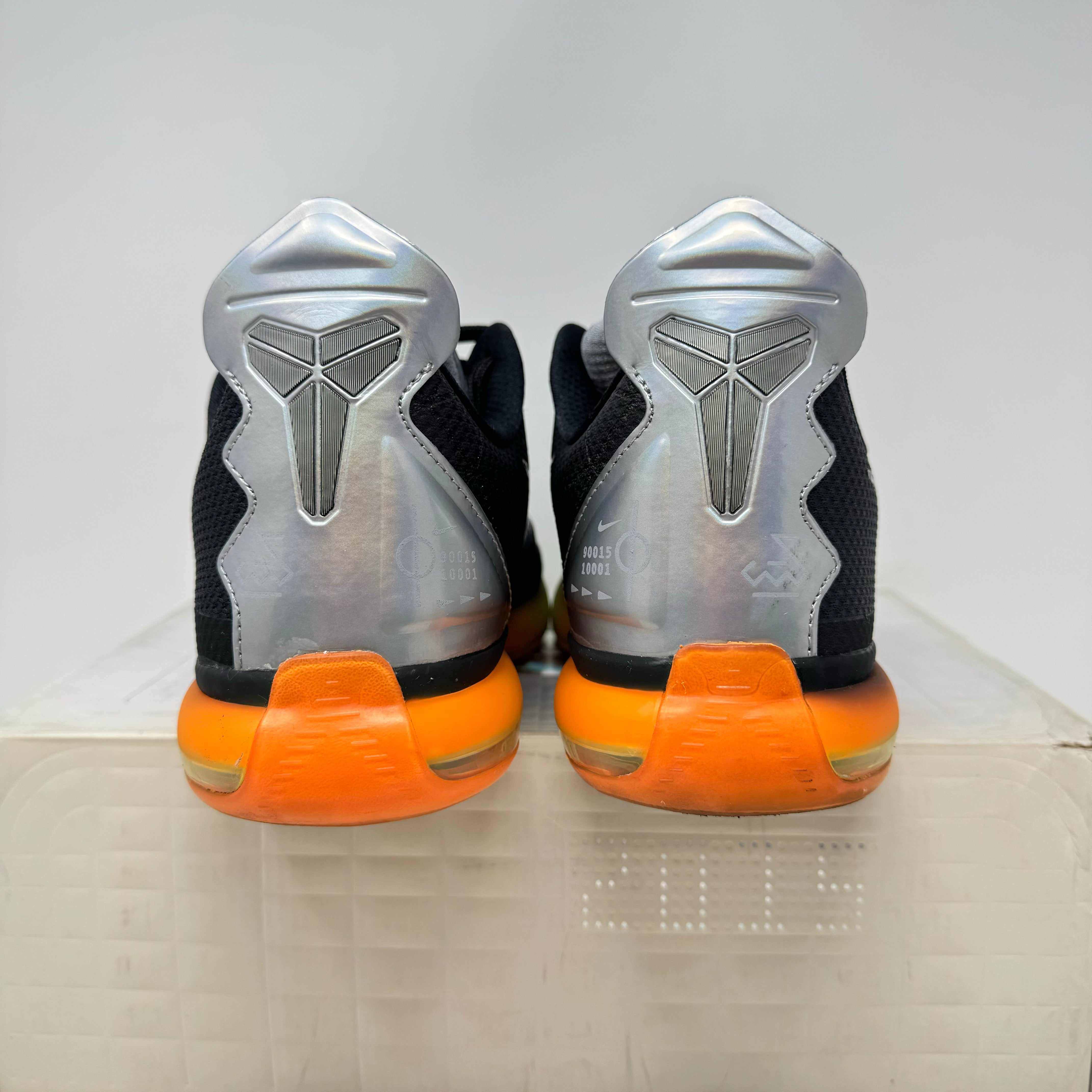 Nike Kobe 10 All-Star pre-owned sneakers with orange soles and silver heel details.