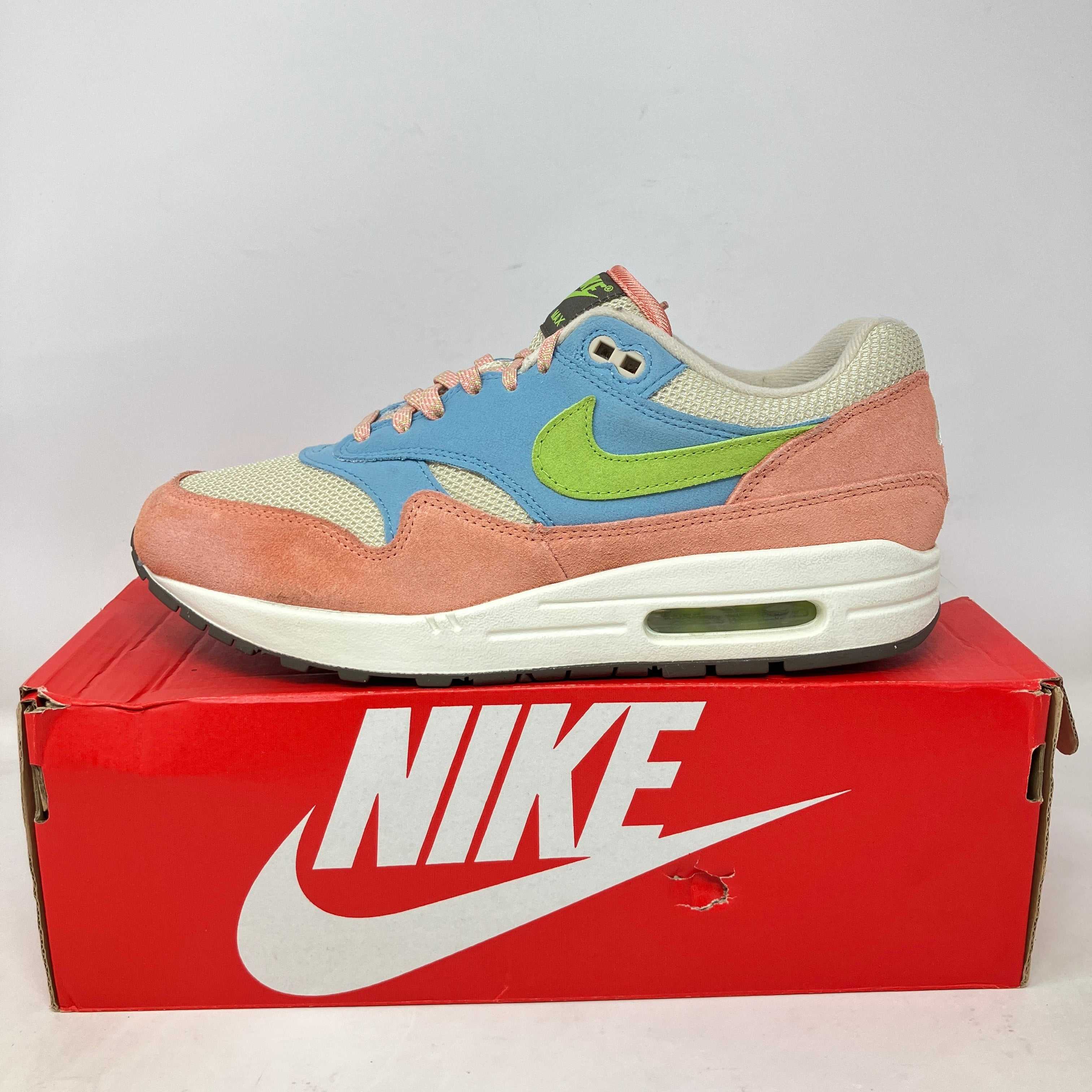 Nike Air Max 1 Light Madder Root Worn Blue sneaker on red Nike box, pre-owned with accessories included