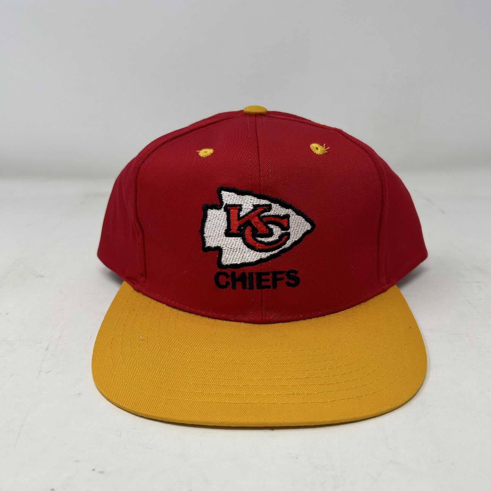 Vintage Kansas City Chiefs snapback hat with red crown and yellow brim