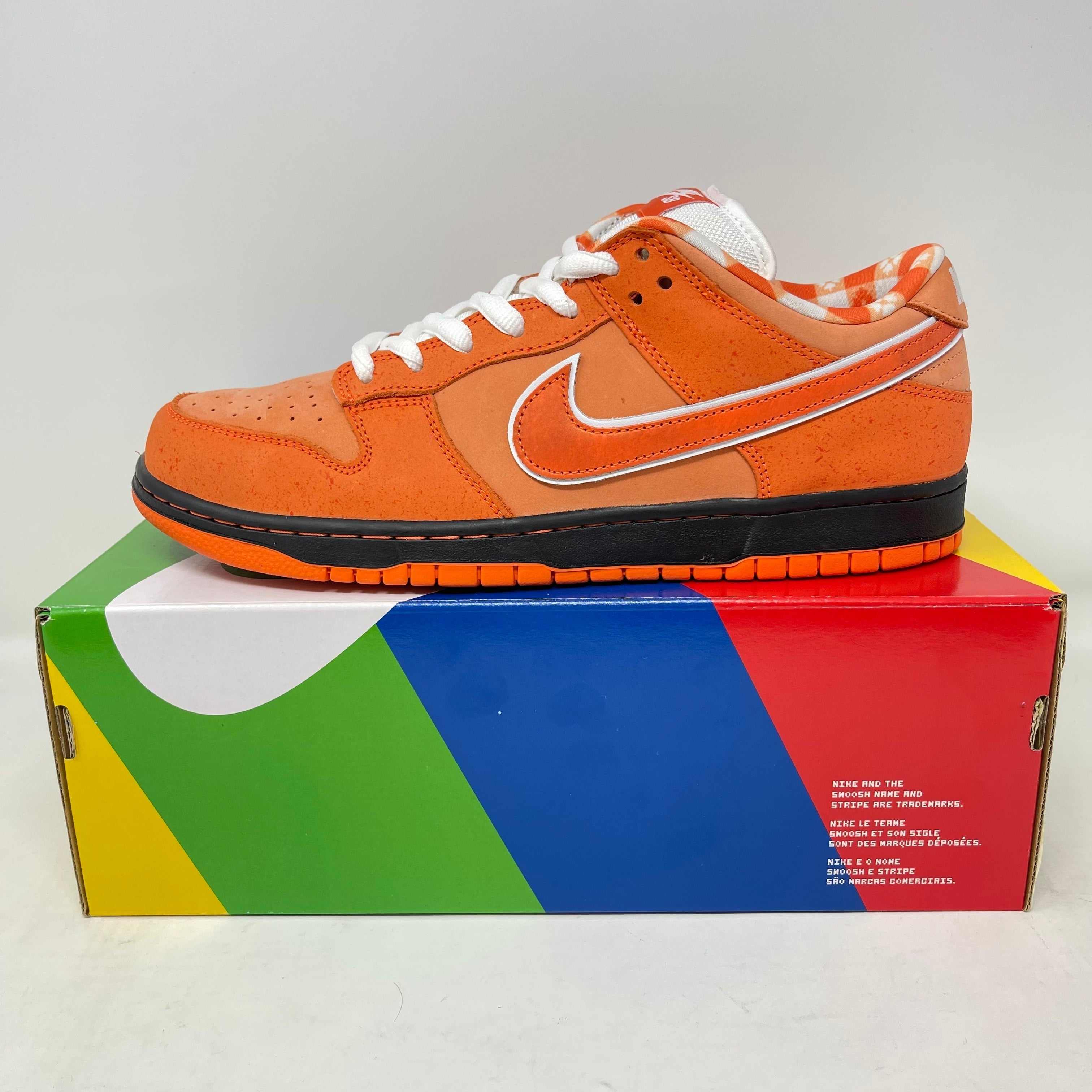 Nike SB Dunk Low Concepts Orange Lobster sneaker on colorful box, brand new with all accessories included