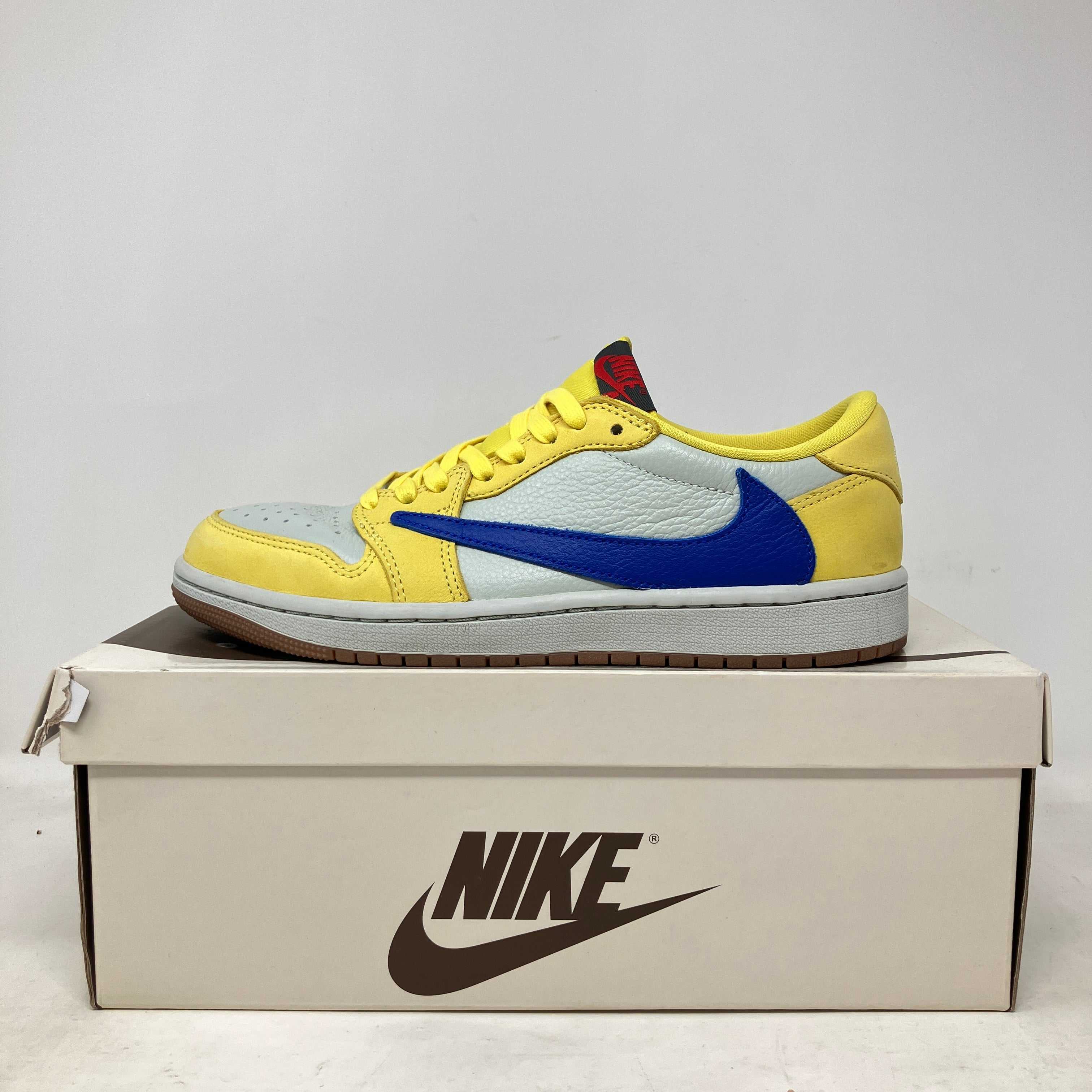 Jordan 1 Retro Low OG Travis Scott Canary women's sneaker in pre-owned condition on Nike box