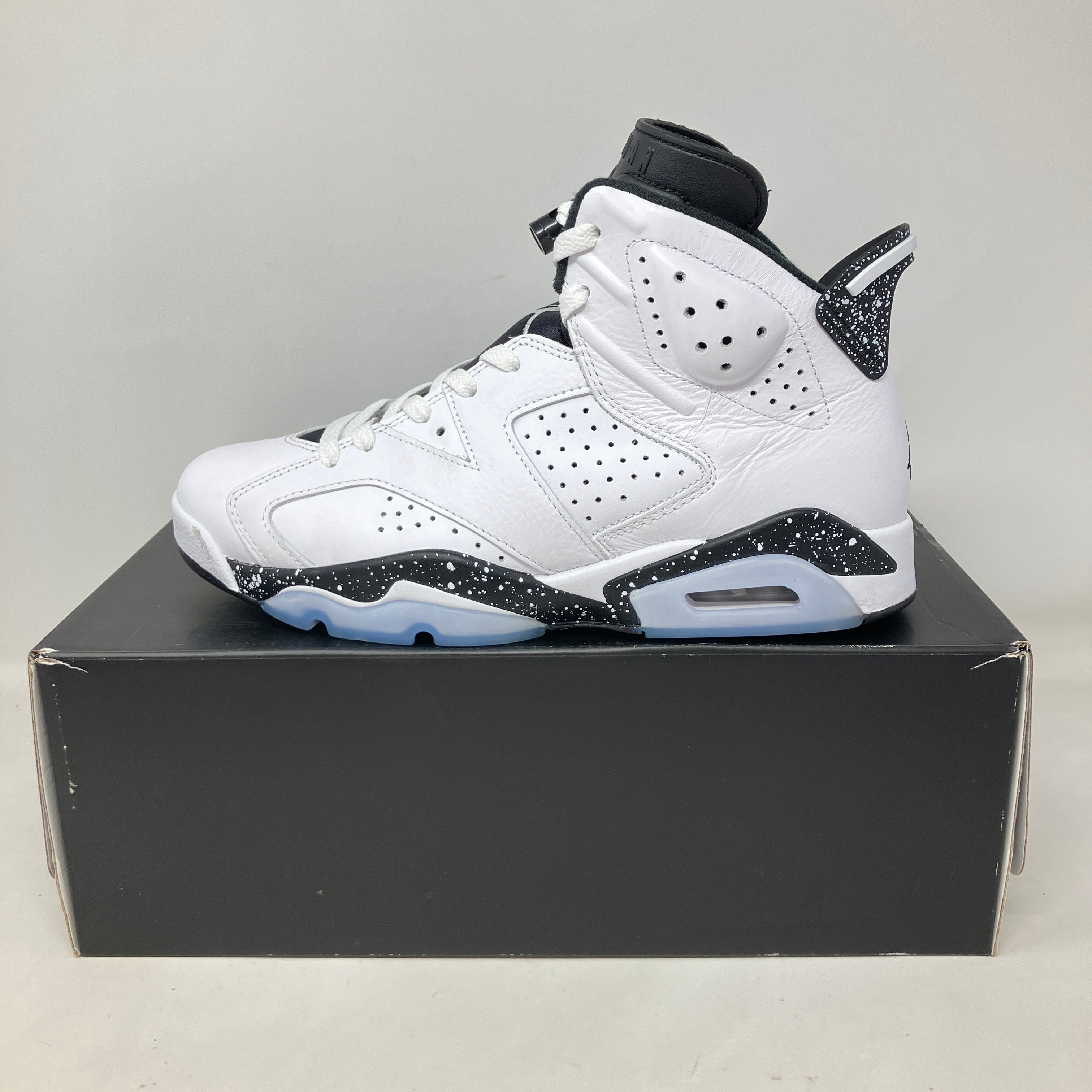 Jordan 6 Retro Reverse Oreo pre-owned white and black high-top sneaker with speckled midsole on black box