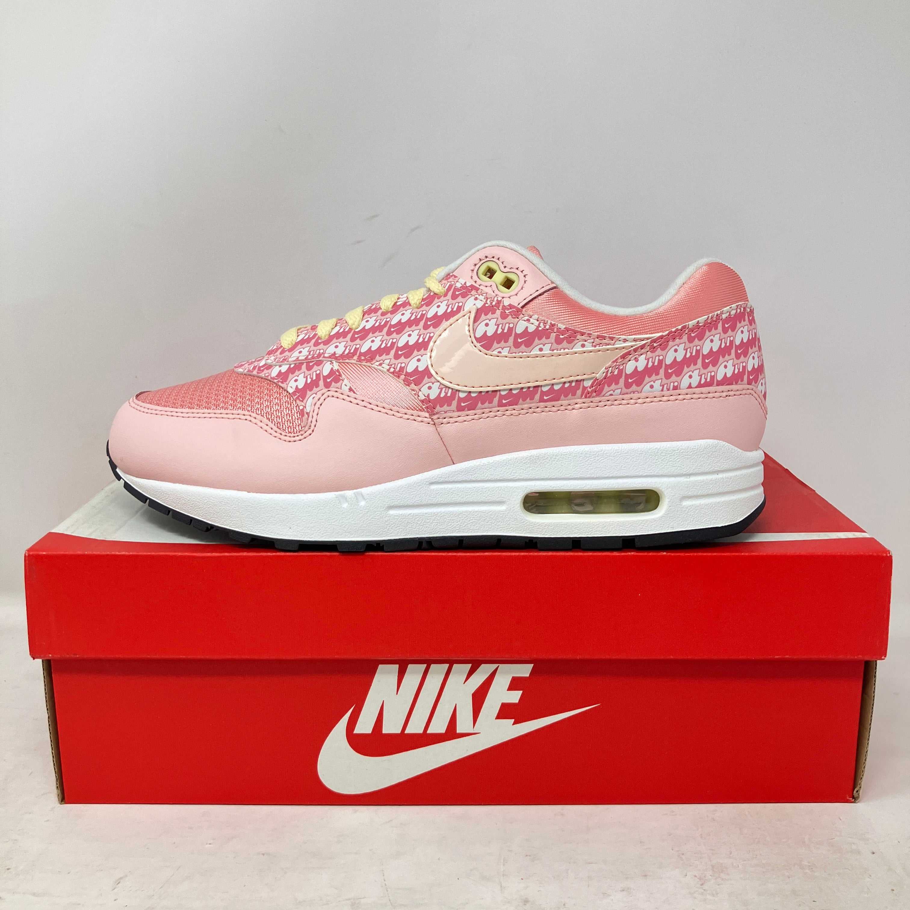 Nike Air Max 1 Strawberry Lemonade pink sneaker on red Nike box, brand new with all accessories