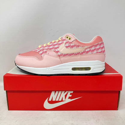 Nike Air Max 1 Strawberry Lemonade pink sneaker on red Nike box, brand new with all accessories