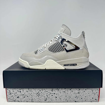 Jordan 4 Retro Frozen Moments sneaker in light grey with chrome accents on box