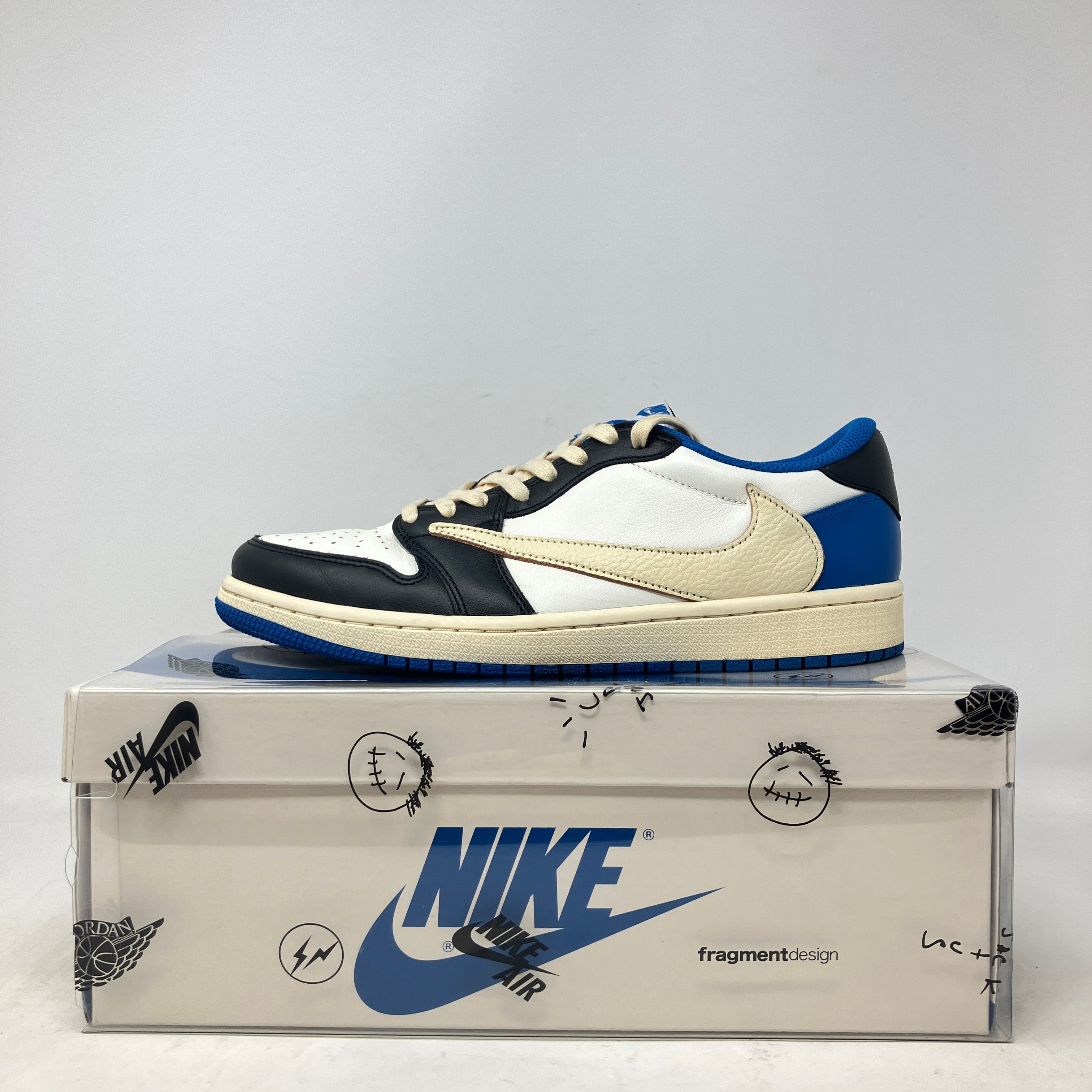 Jordan 1 Retro Low OG SP Fragment x Travis Scott on shoebox, pre-owned condition.