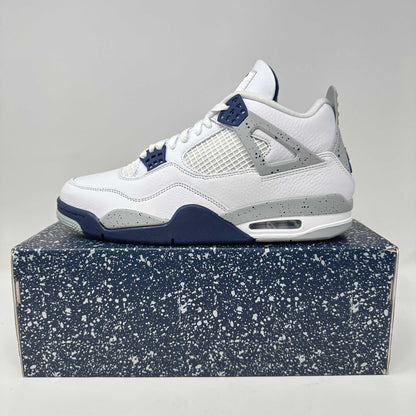 Jordan 4 Retro Midnight Navy sneaker in white with navy and grey accents on speckled box