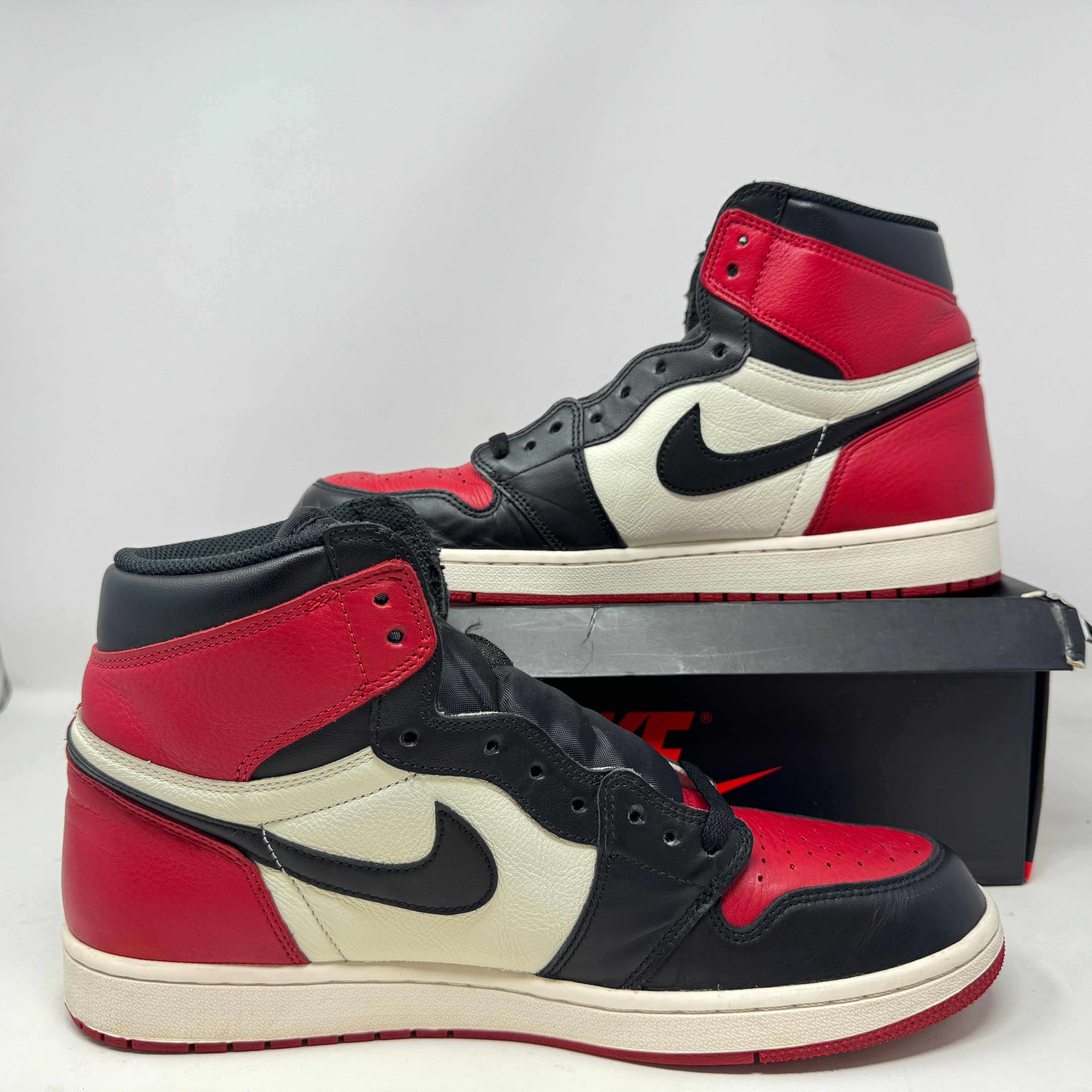 Jordan 1 Retro High Bred Toe sneakers, preowned, with box.