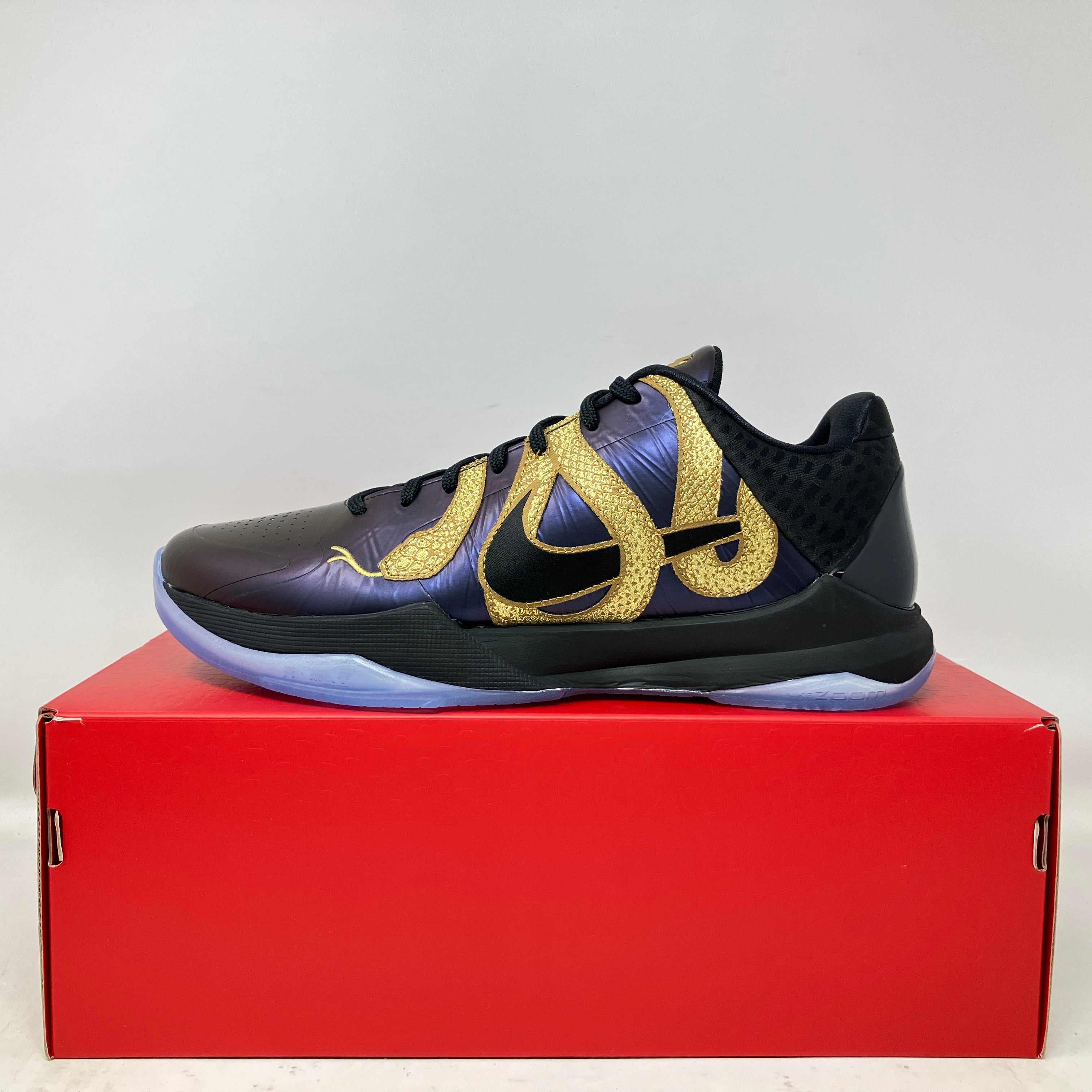 Nike Kobe 5 Protro Year of the Mamba Eggplant black and gold basketball shoe on red box, brand new with accessories included