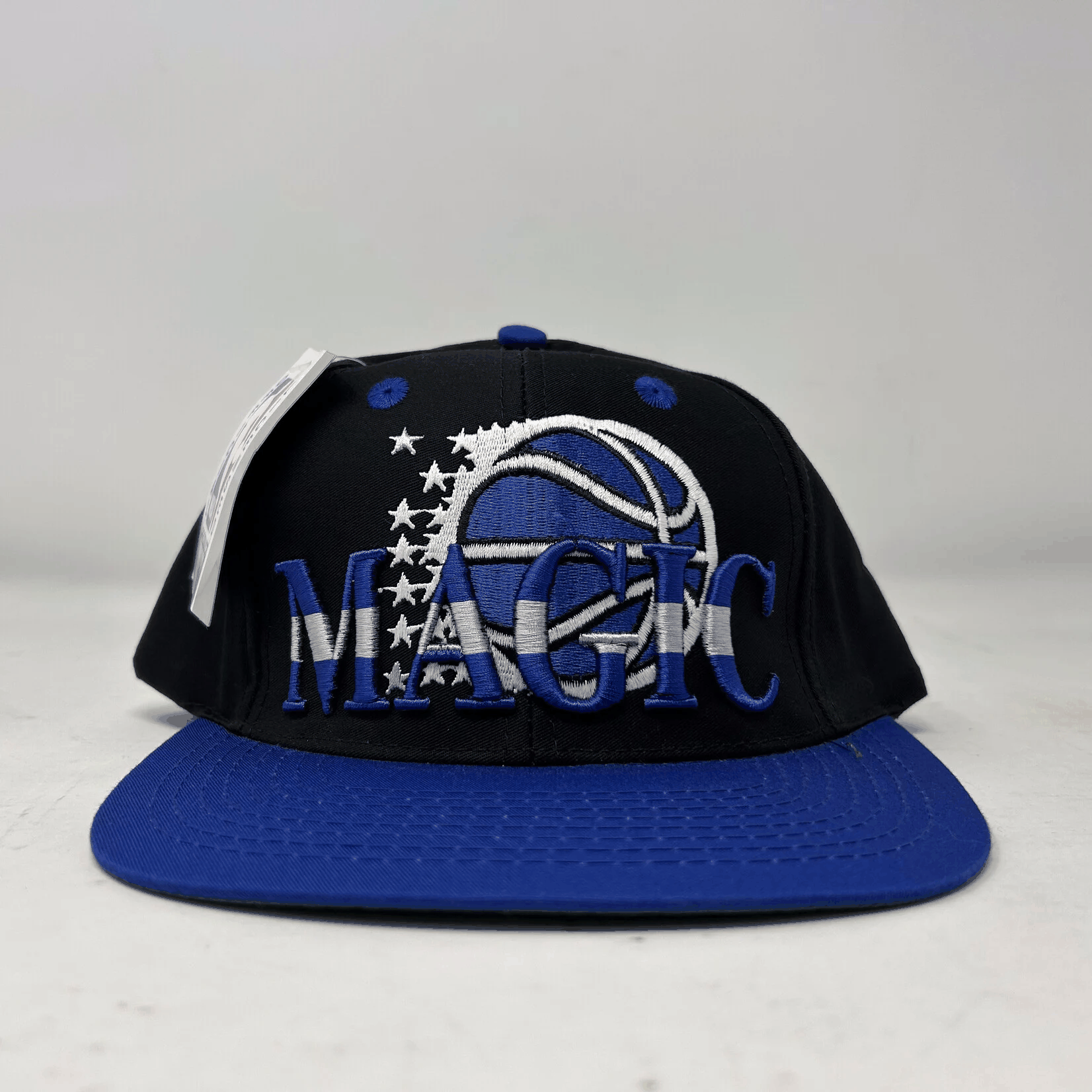 Vintage Orlando Magic black and blue snapback cap with embroidered logo and stars, brand new condition