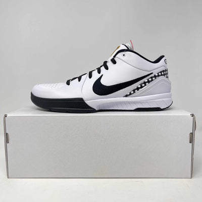 Nike Kobe 4 Protro basketball shoe in white with black leather accents, a bold swoosh, and checkered heel trim.