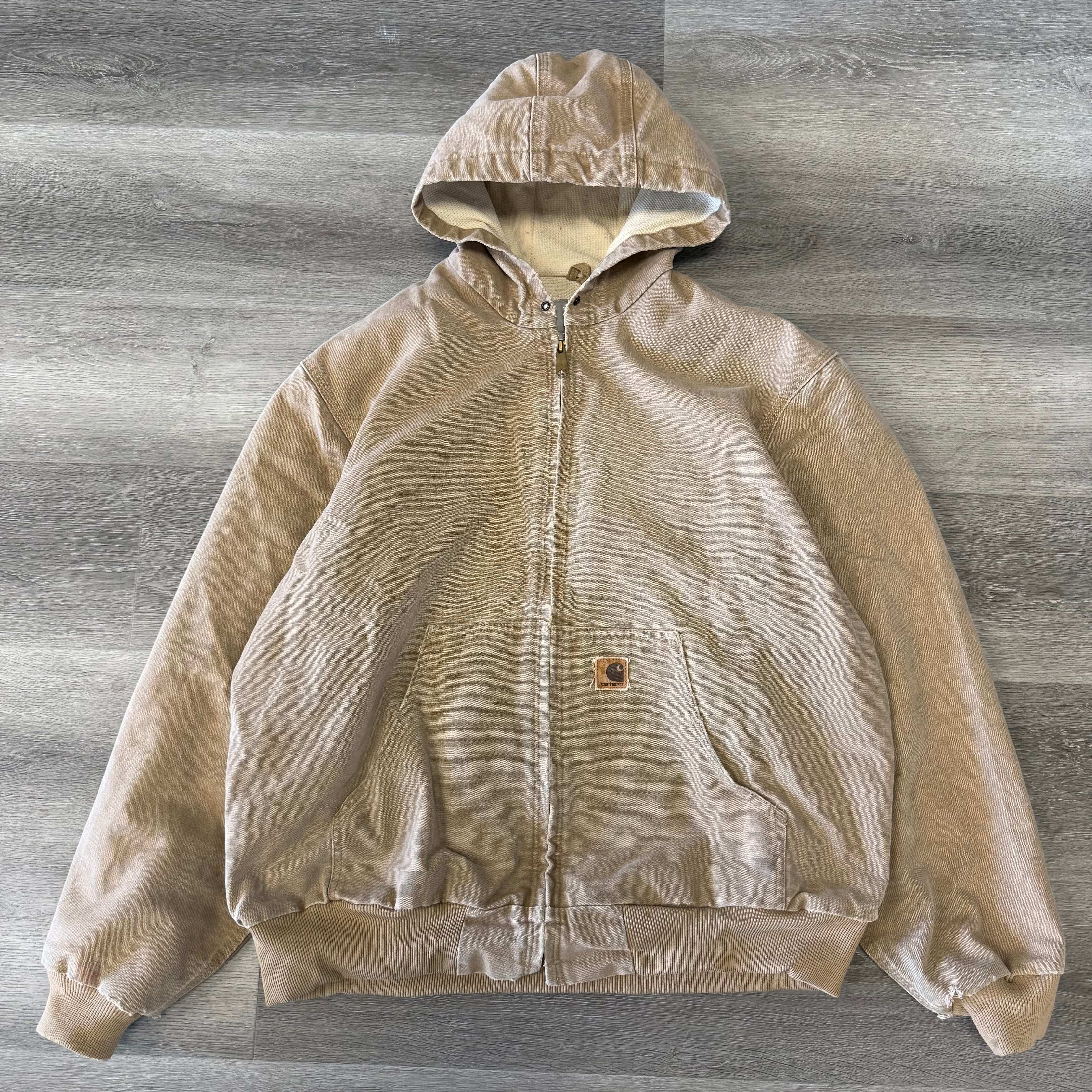 Vintage Carhartt light brown jacket with thermal lining, pre-owned condition, hooded design.
