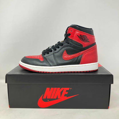 Jordan 1 Retro High Bred Banned 2016 sneaker in black and red on Nike box, pre-owned with accessories included