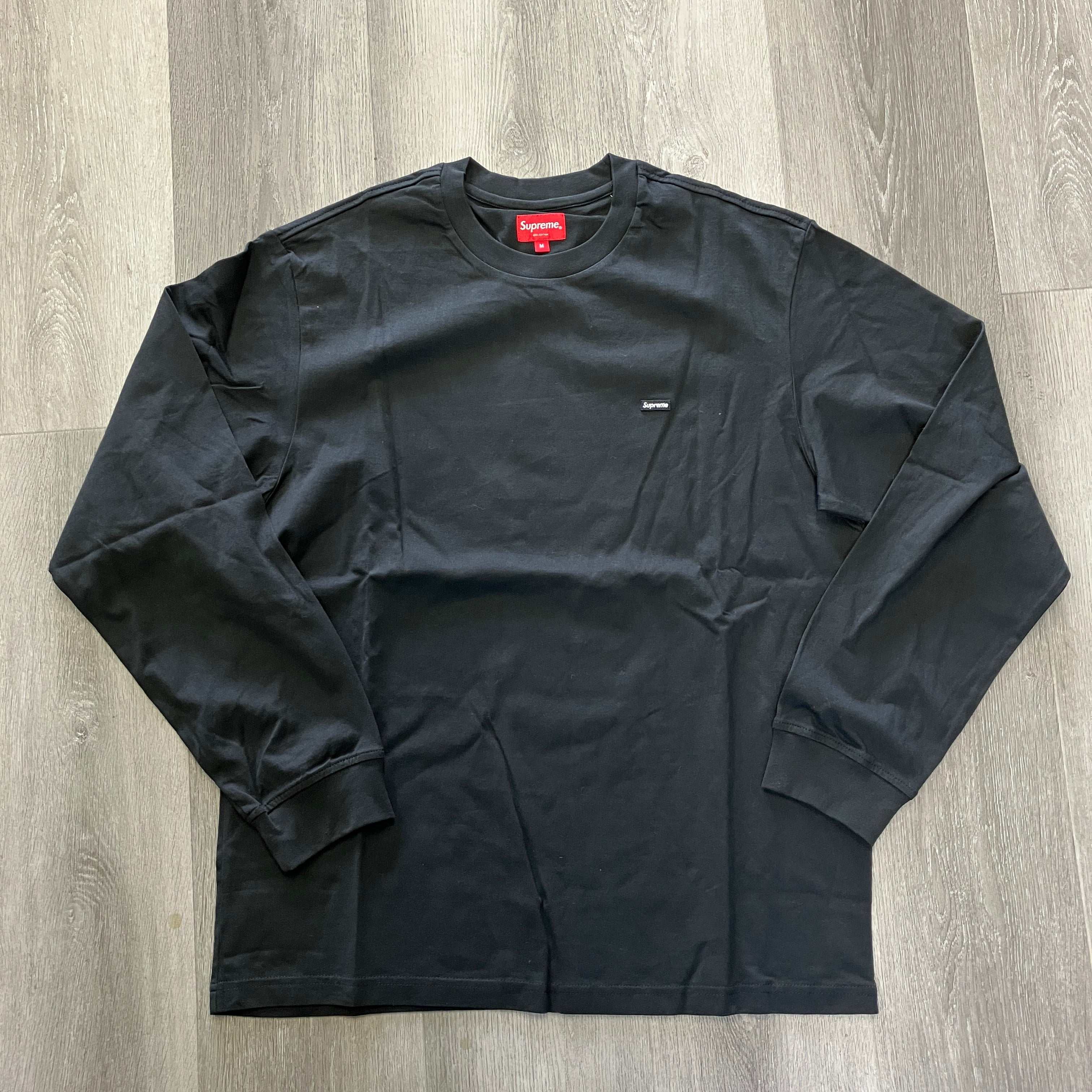 Supreme Small Box L/S Tee FW20 black long sleeve shirt with small chest logo on wooden floor