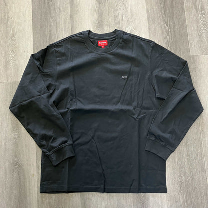 Supreme Small Box L/S Tee FW20 black long sleeve shirt with small chest logo on wooden floor
