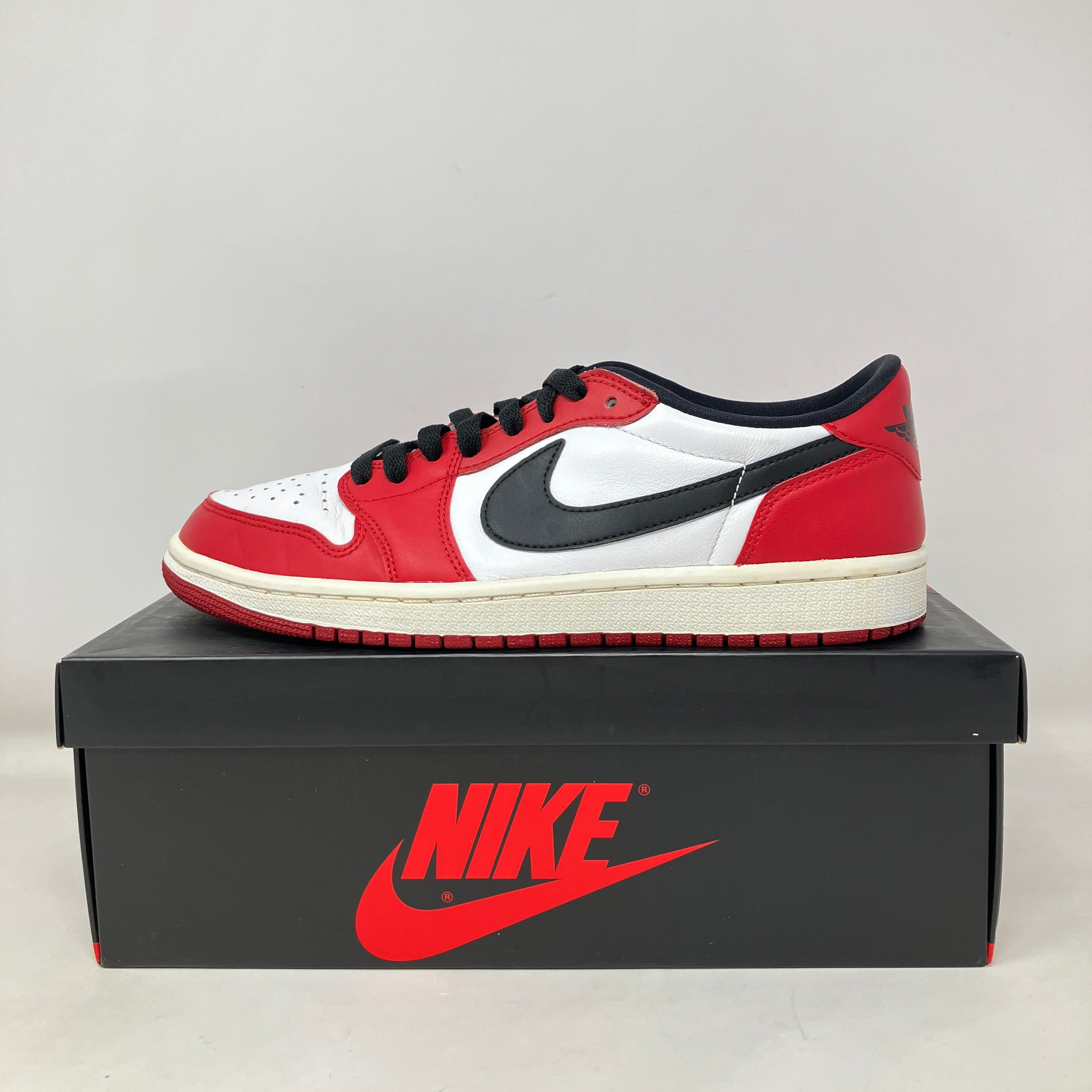 Pre owned Jordan 1 Retro Low Chicago 2016 sneaker with black swoosh, red and white leather on Nike box with logo