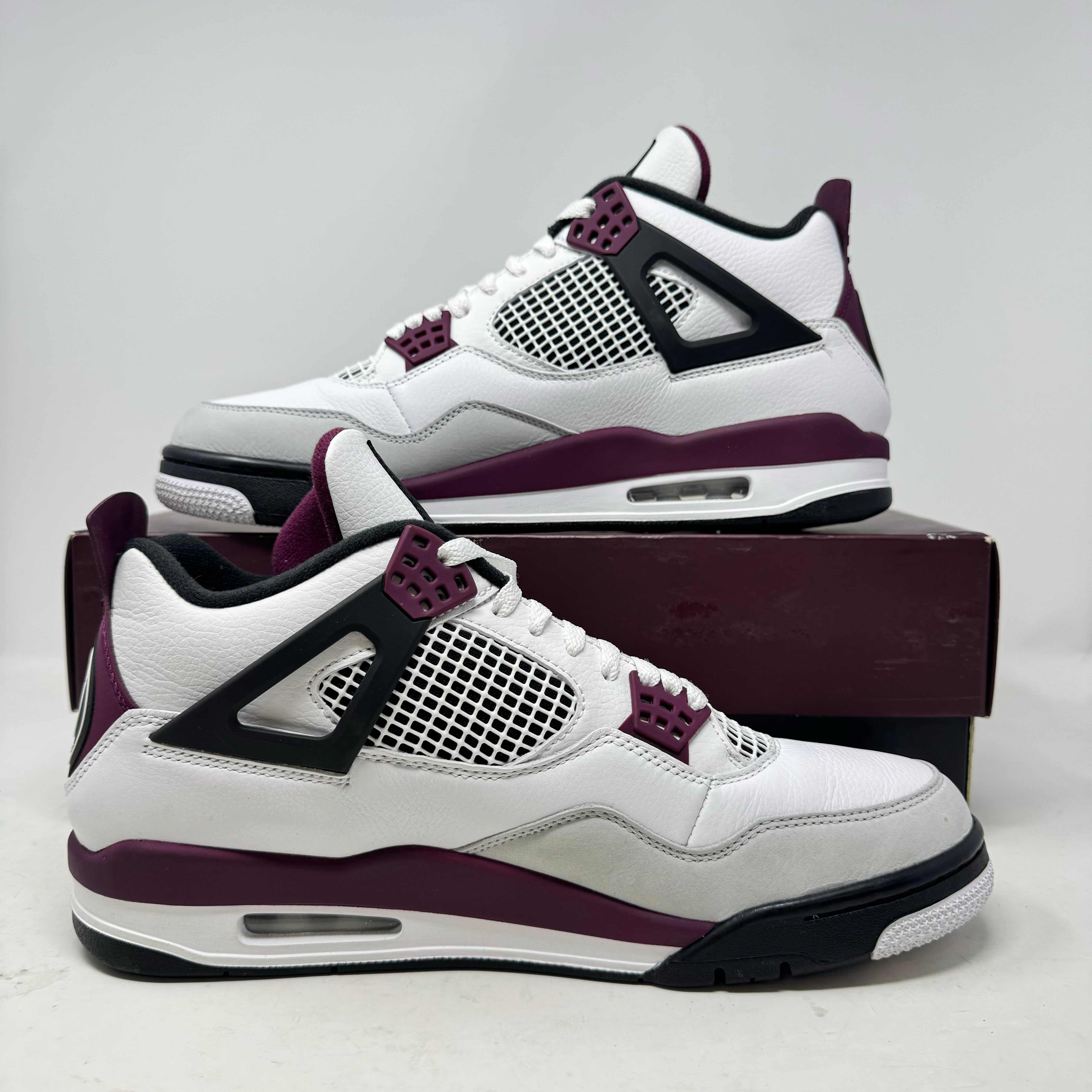 Jordan 4 Retro PSG sneakers in pre-owned condition with accessories included.