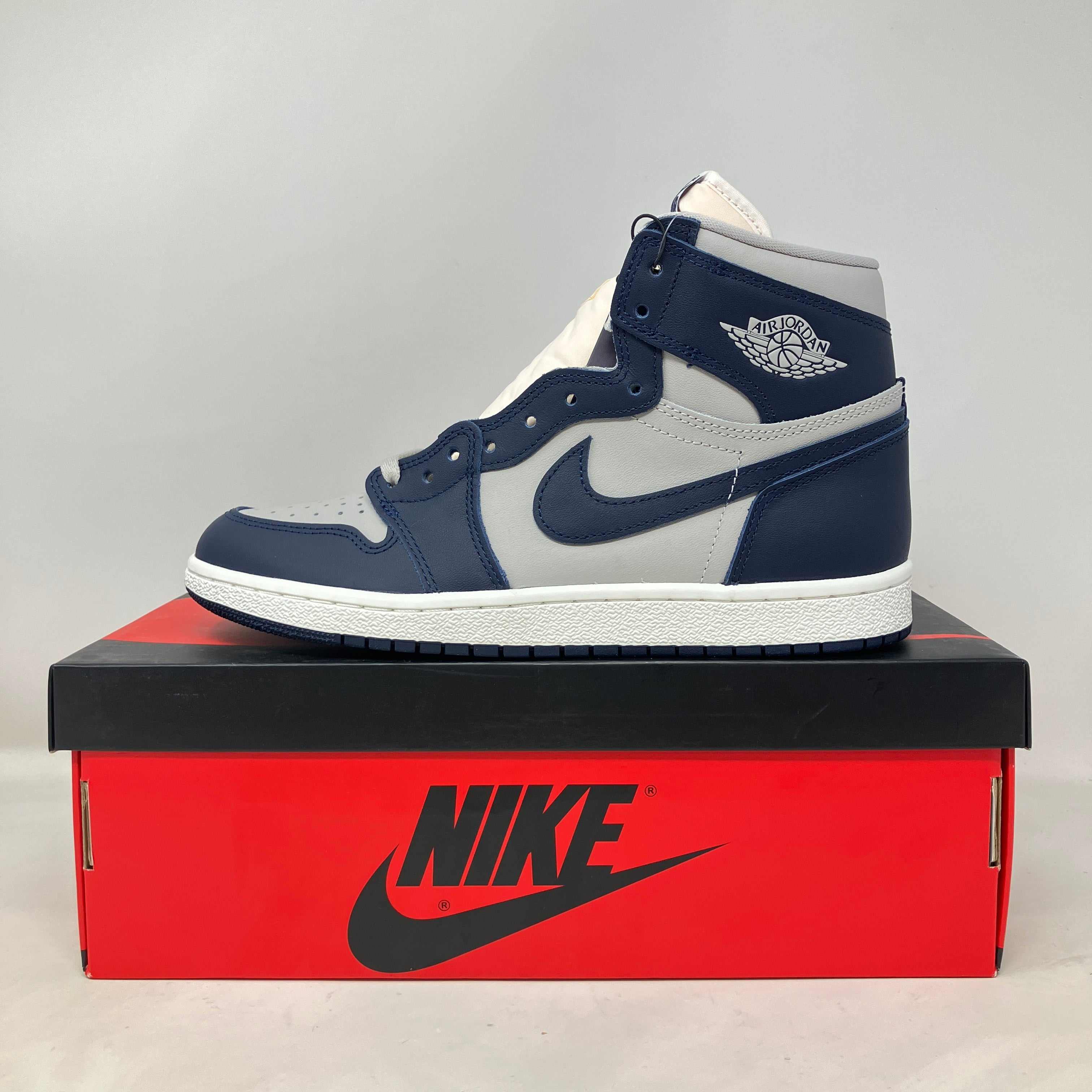 Jordan 1 Retro High '85 Georgetown sneaker in navy and gray on Nike box with replacement lid, brand new condition