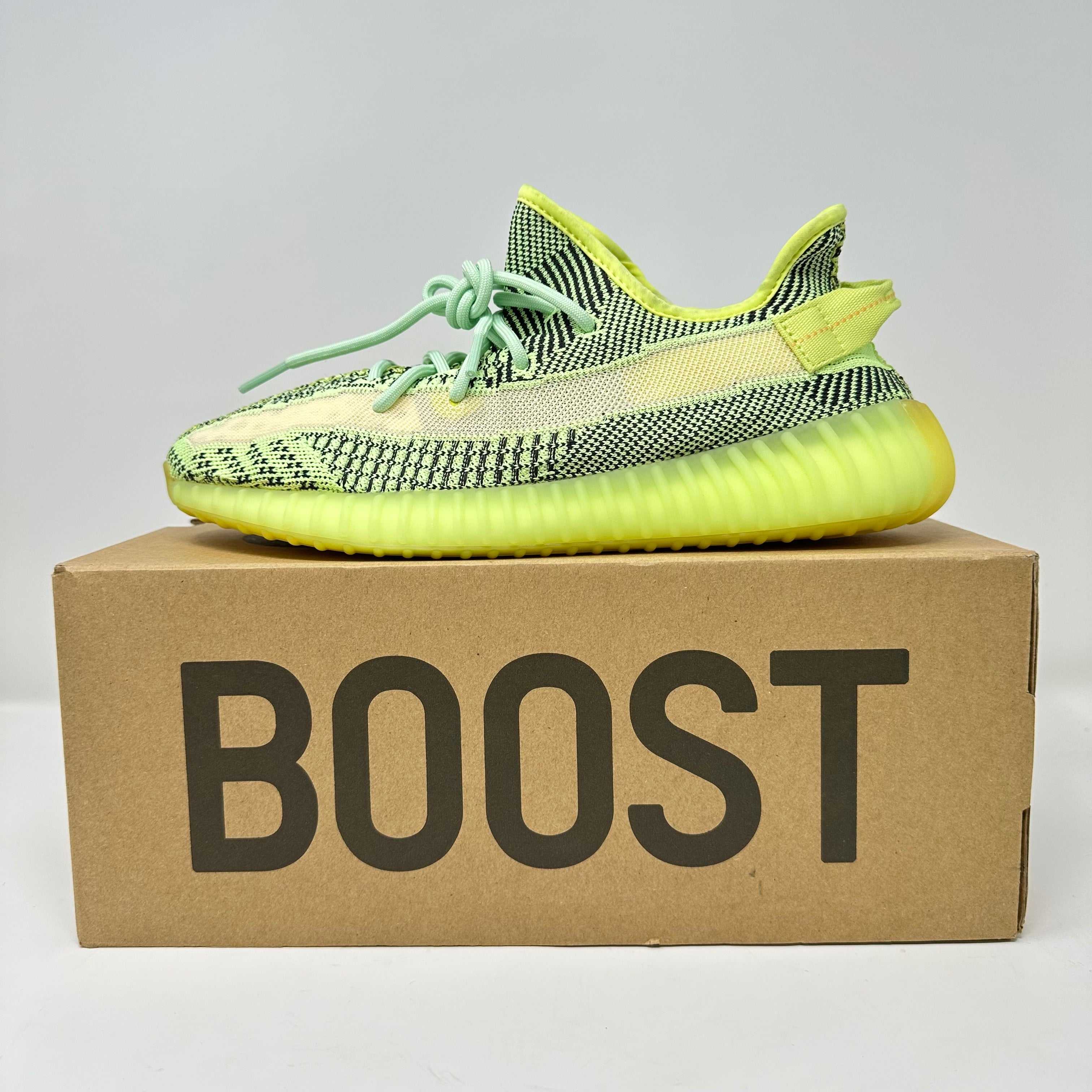 adidas Yeezy Boost 350 V2 Yeezreel sneaker on Boost box, brand new with all accessories included.