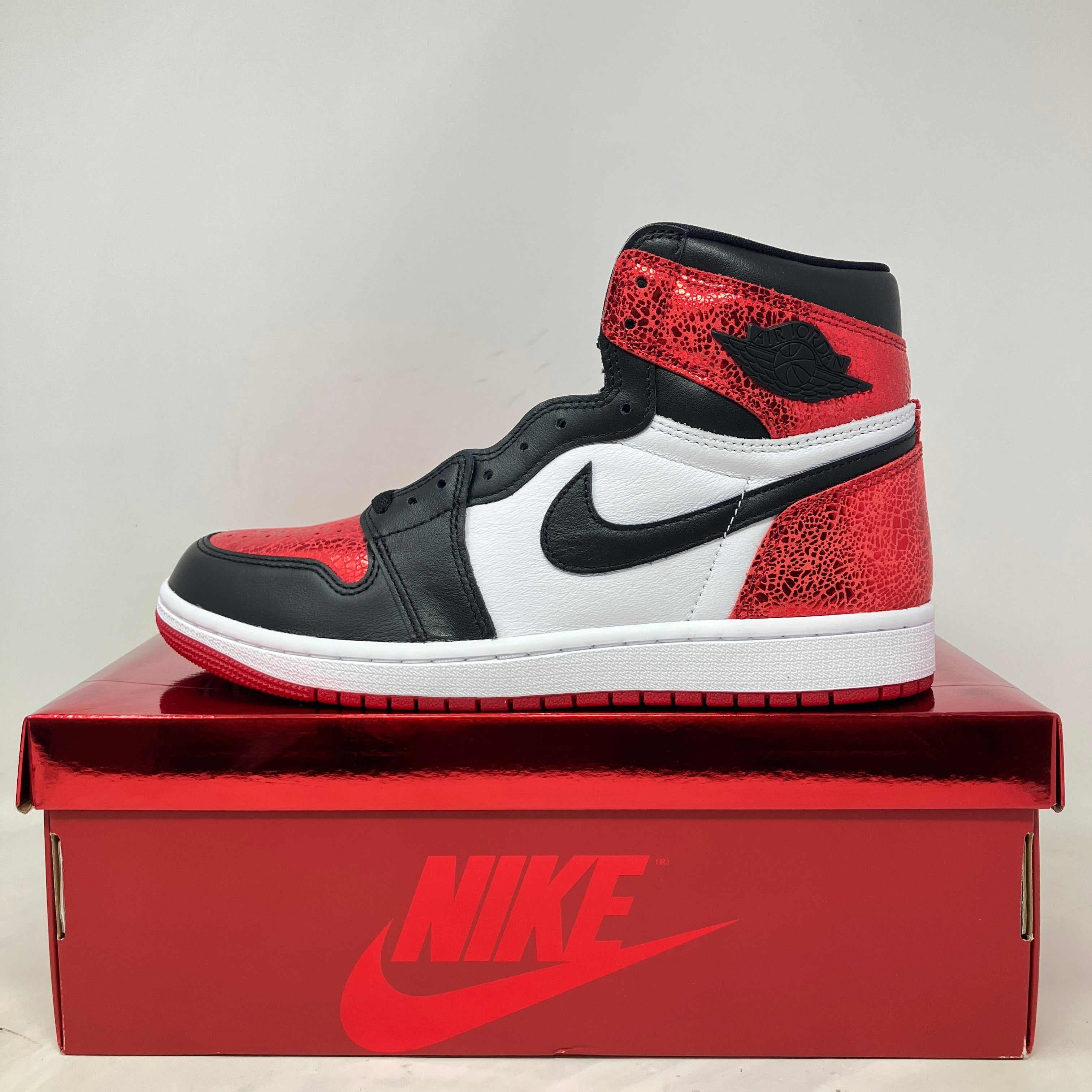 Jordan 1 High OG Ruby women's sneaker in brand new condition on red Nike box