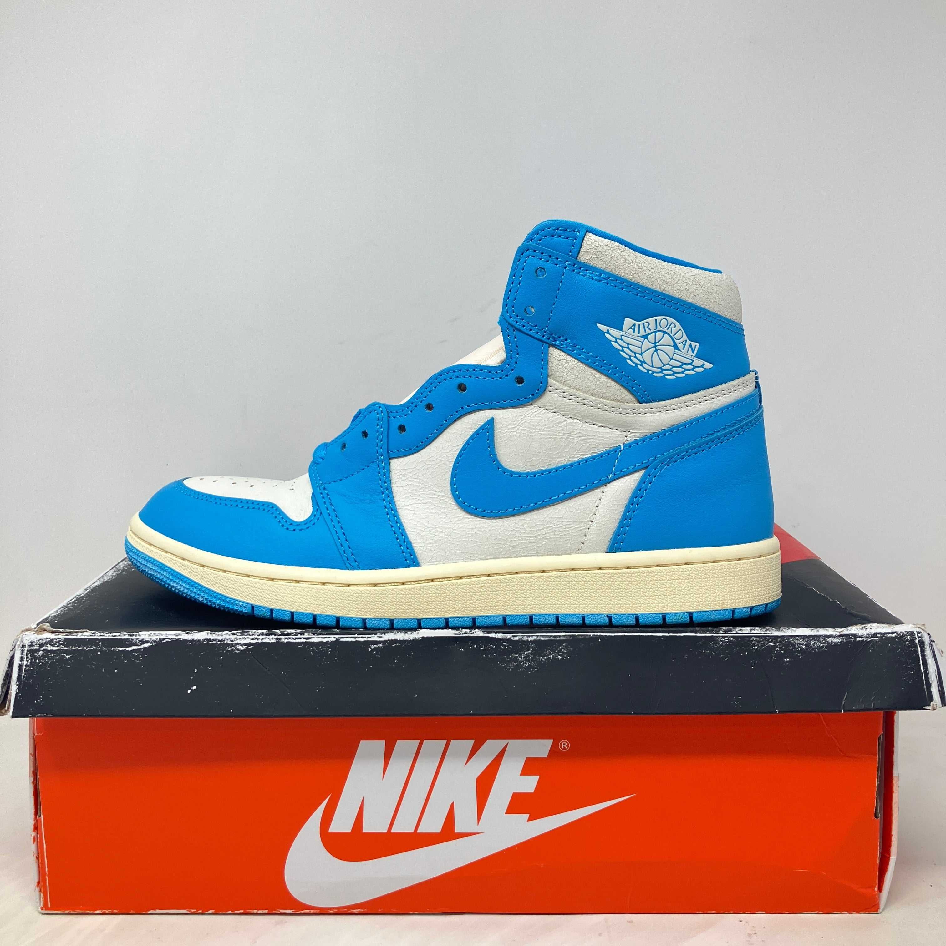 Jordan 1 Retro High OG UNC Reimagined sneaker in blue and white on Nike box