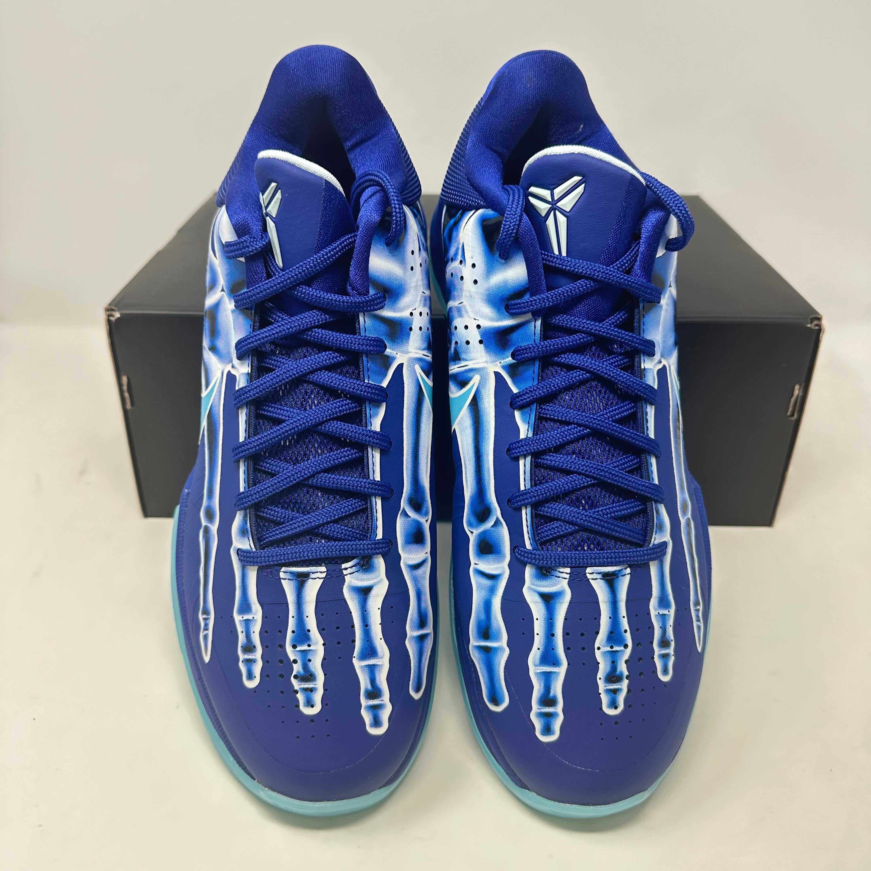 Brand new Nike Kobe 5 Protro X-Ray sneakers with unique skeletal design and included accessories.