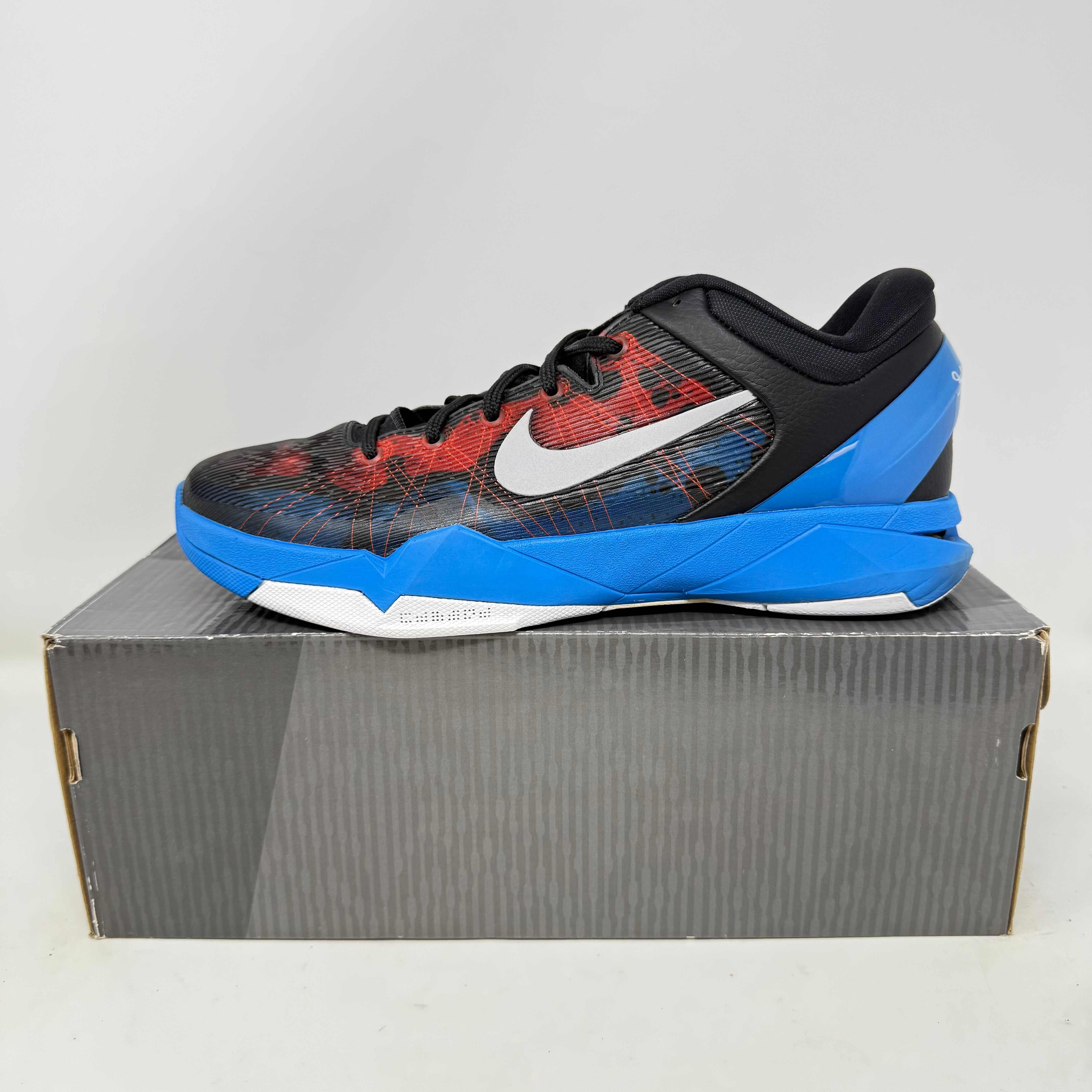 Nike Kobe 7 Poison Dart Frog basketball shoe in black, blue, and red with white Nike swoosh on gray box