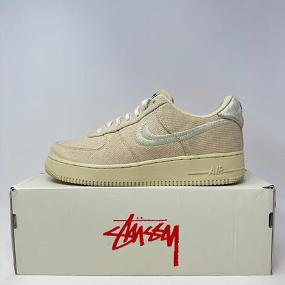 Nike Air Force 1 Low Stussy Fossil beige sneaker on box, pre-owned with accessories included
