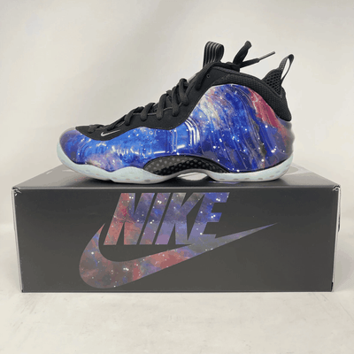 Nike Air Foamposite One Galaxy high-top sneaker with glossy blue, purple and pink galaxy-print shell, black mesh and icy translucent sole.