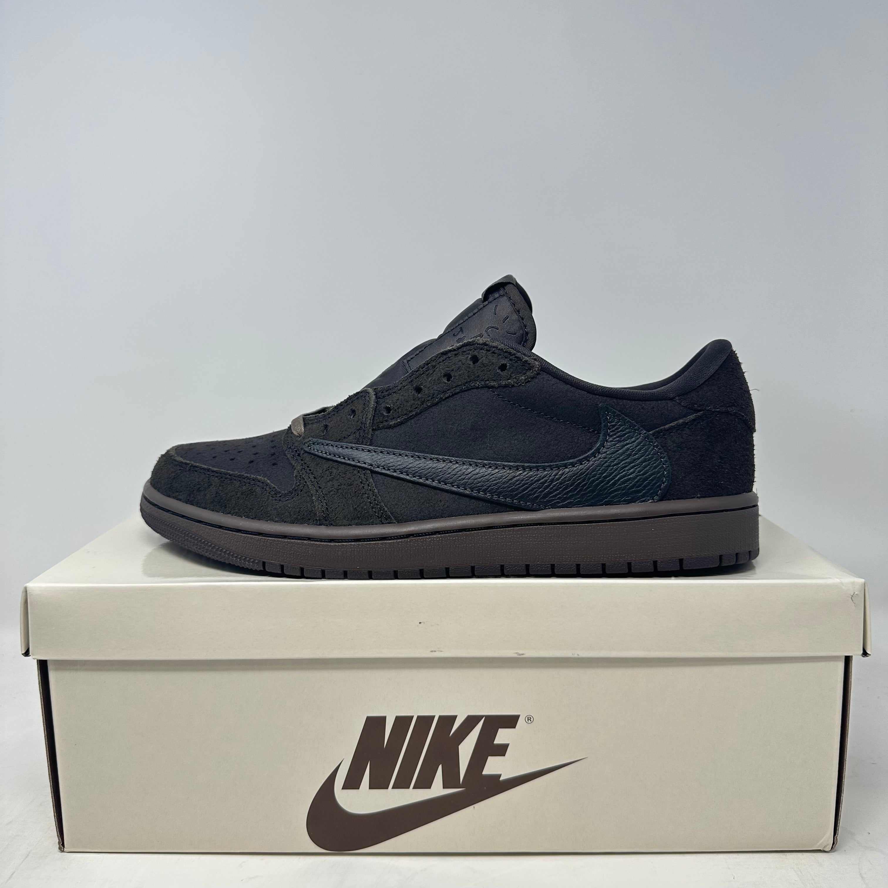 Jordan 1 Retro Low OG Travis Scott Velvet Brown sneaker on white Nike box, brand new with accessories included